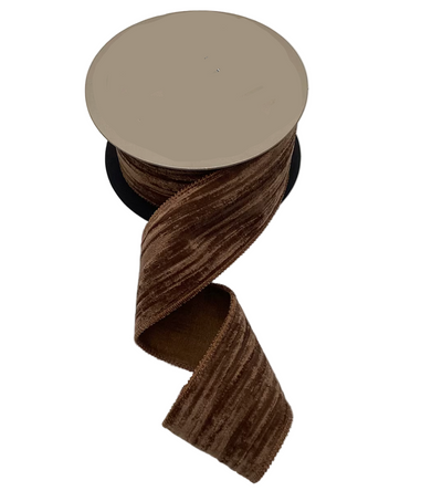 Spool of brown ribbon with 'd.stevens' label on a white background